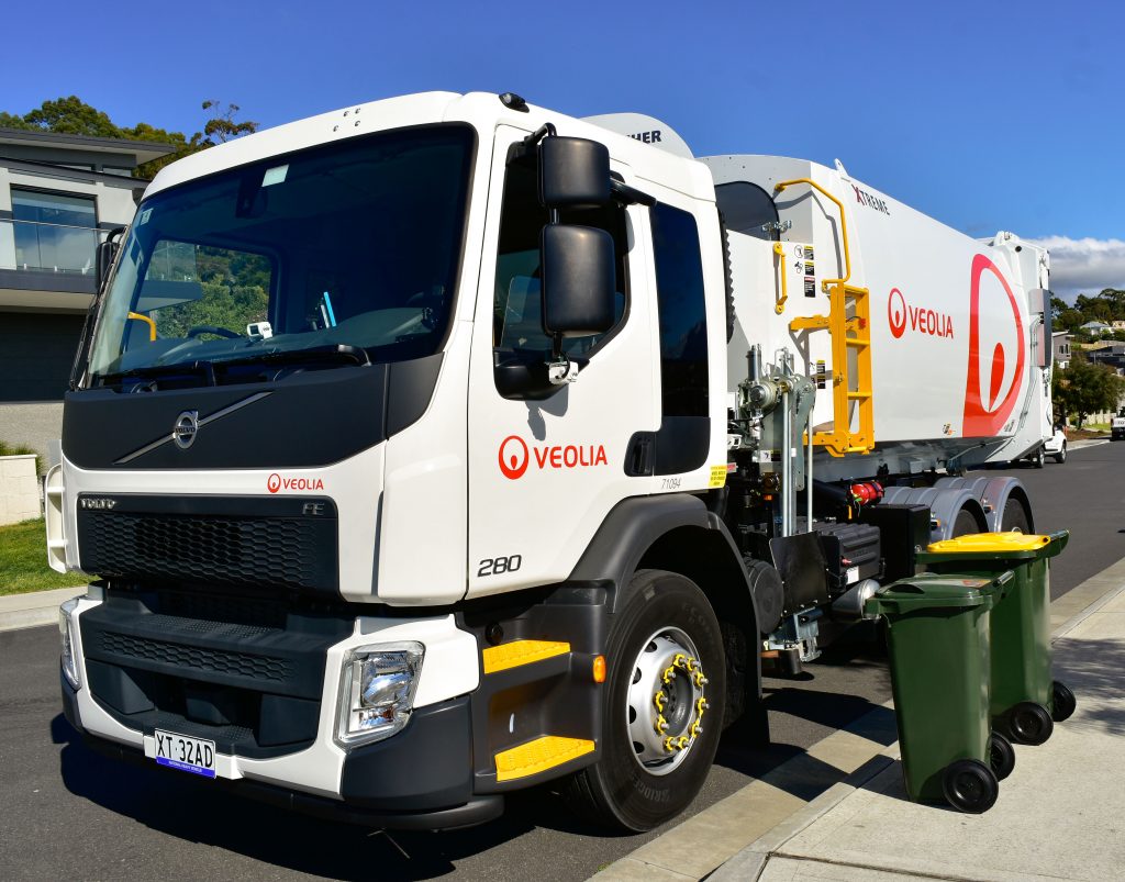 A Veolia-branded truck collects kerbside waste